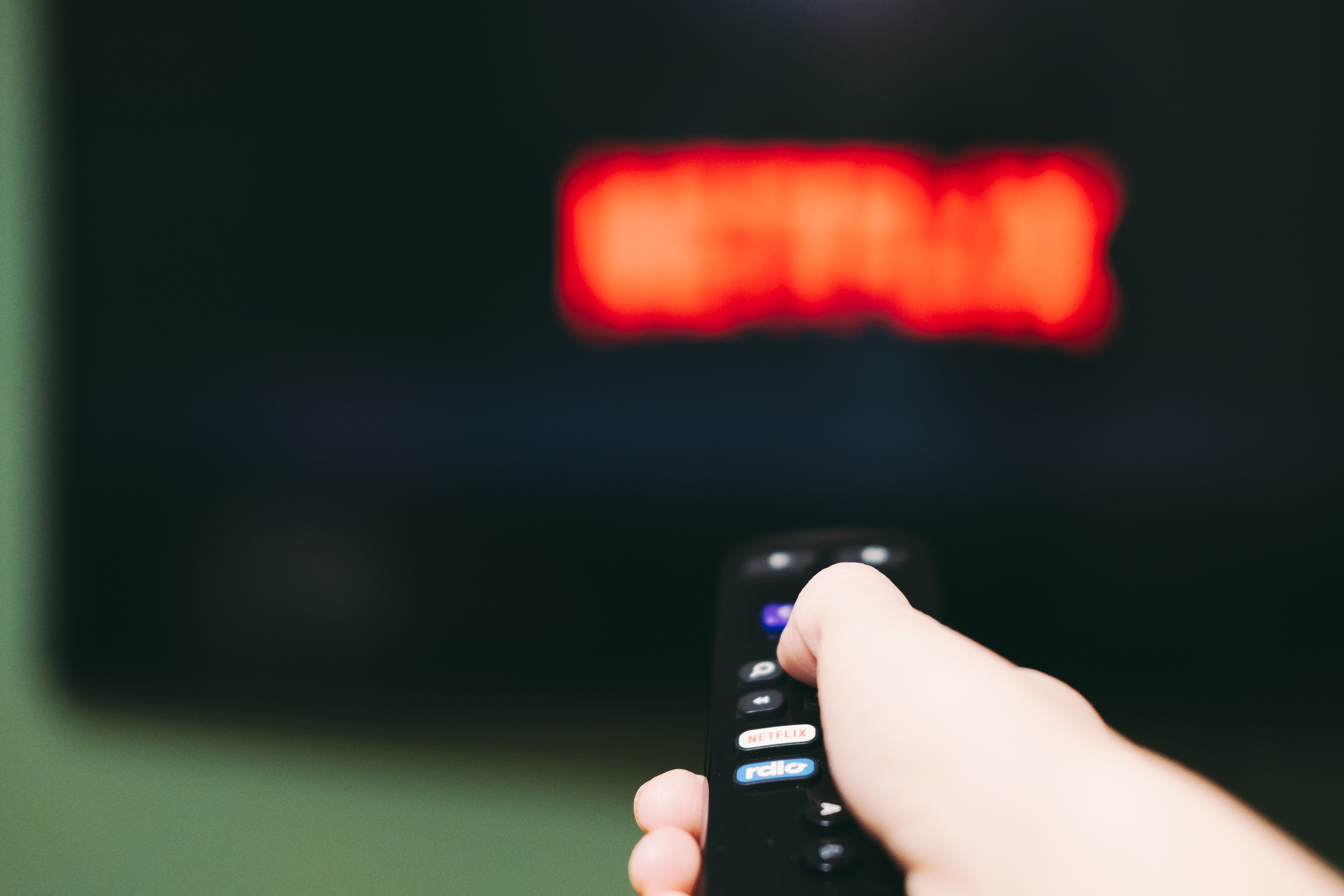 IPTV vs Netflix comparison showing live TV and on-demand streaming
